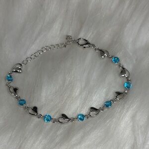 Sterling Silver Hearts with Blue Topaz Link Bracelet